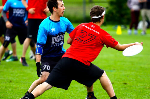 A player throwing a forehand during and ultimate frisbee tournament